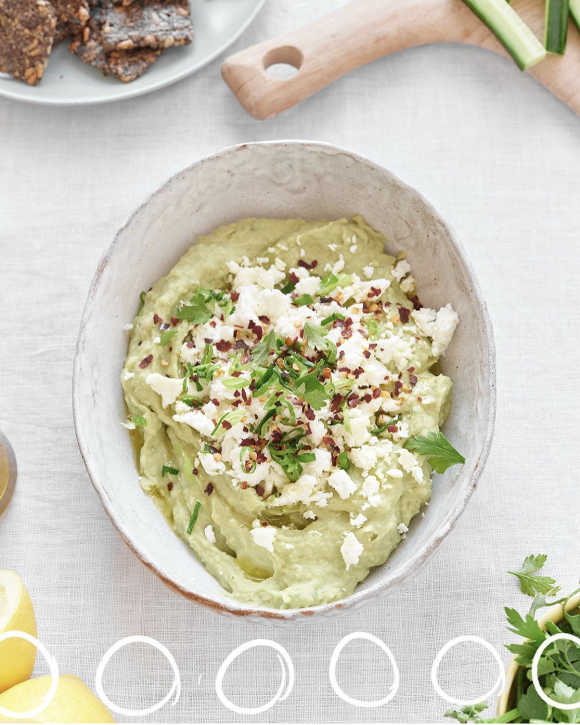 A bowl of green blended dip - cannellini bean guacamole